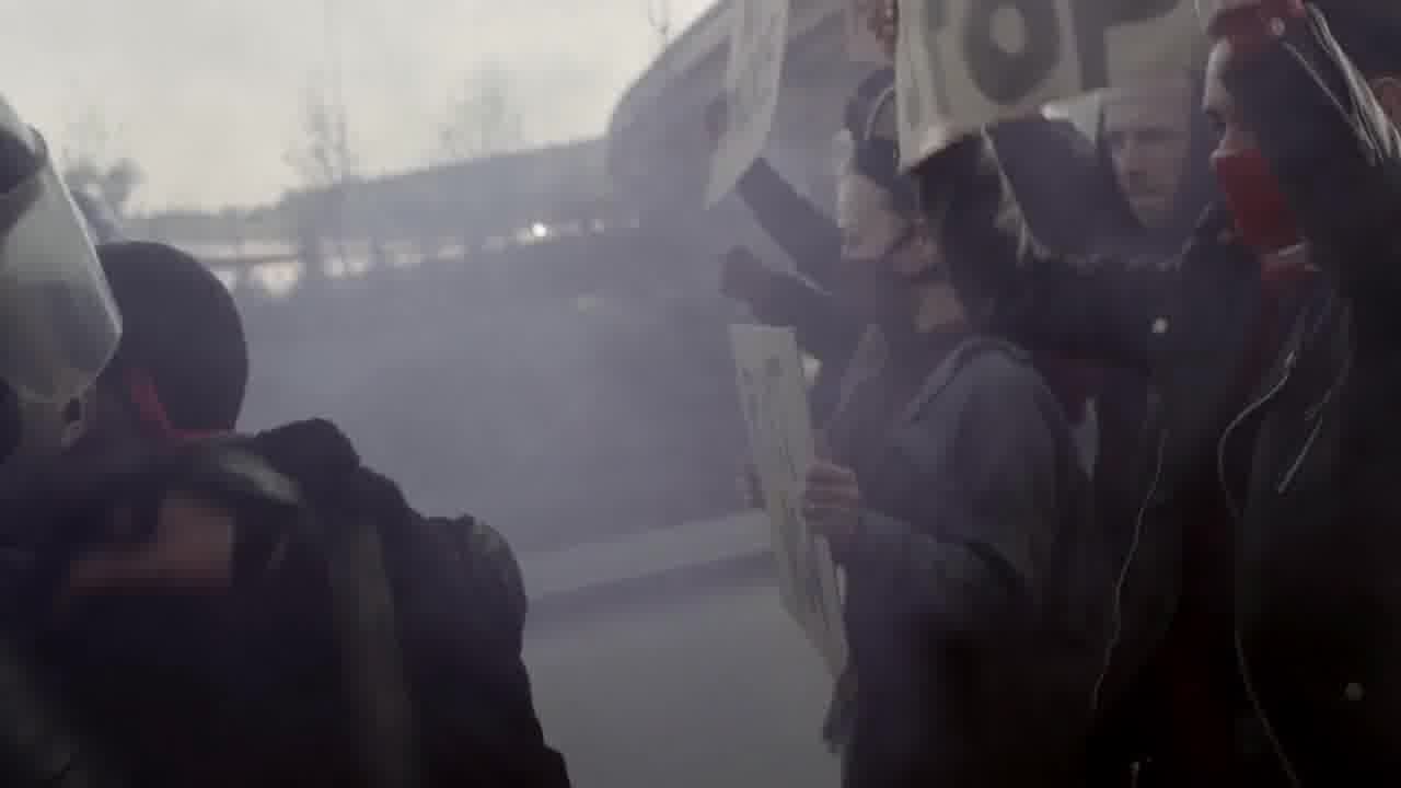 a group of people holding signs